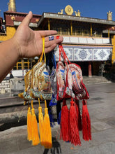 Load image into Gallery viewer, Lucid Sachet Treasure SachetThere are three colors of fortune-attracting sachets: red, yellow and blue. The sachets have the pattern of the flame Mani Treasure and another pattern of the Ten PhBuddha EnergyBuddha&amp;EnergyLucid Sachet Treasure Sachet Car Hanging Flame Manibo Pattern Red Yellow Blue